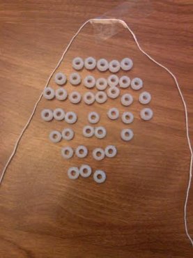 UV bead skull, taped string