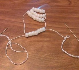 UV bead skull, threading the beads