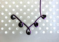 Wire Chandelier Earrings alternative design showing shaping jewelry wire on WigJig jewelry tool.